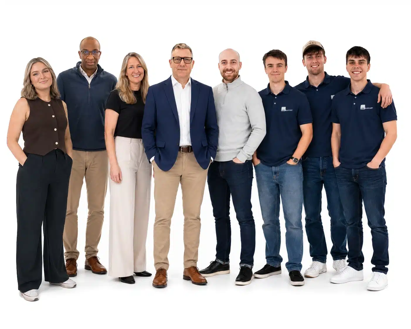 LAN Support team standing together in a bright studio, showcasing the friendly professionals who provide managed IT support and cybersecurity services to businesses across Surrey and London.